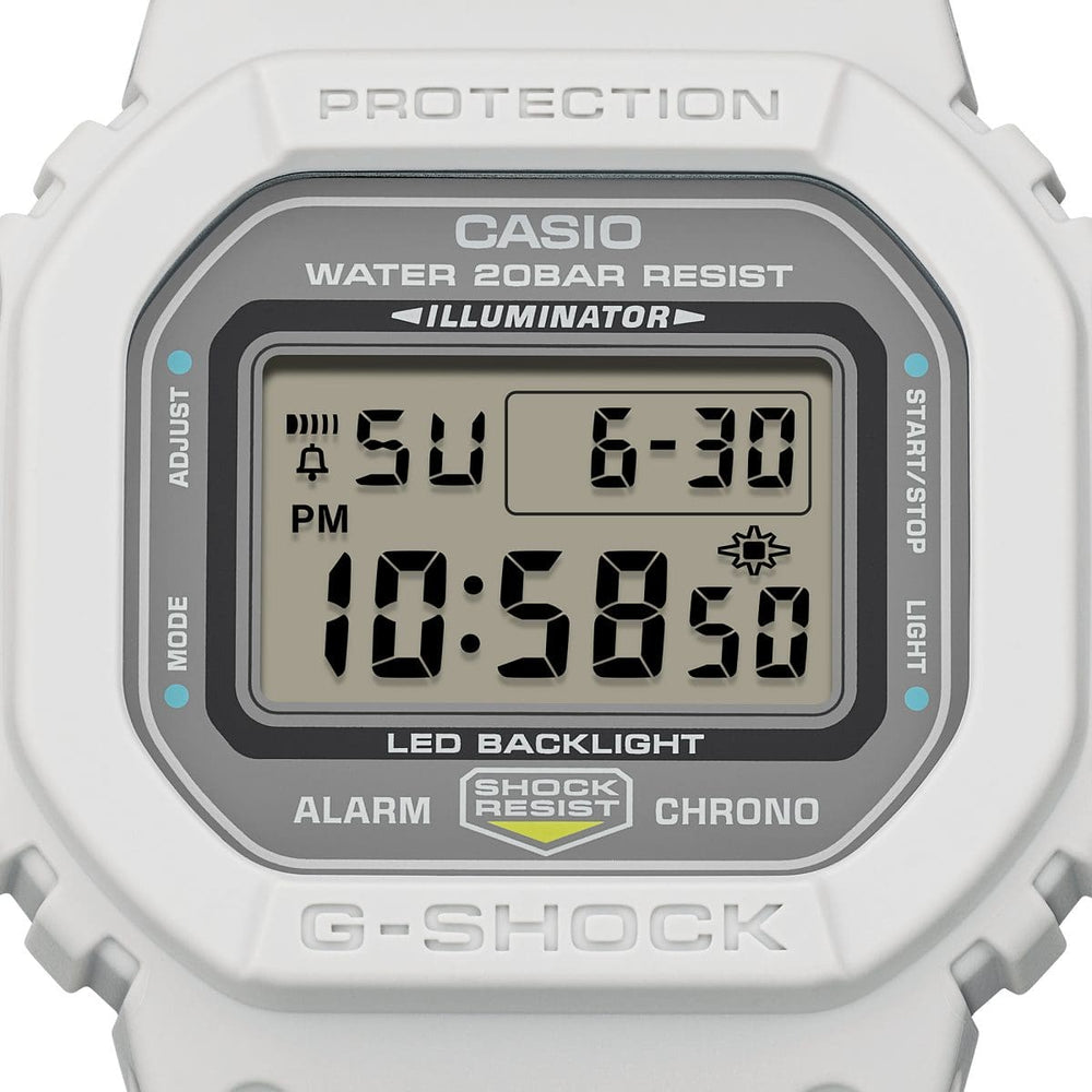Casio G-Shock DW-5600MNC-7A8ER kellotaulu ja vaalea runko