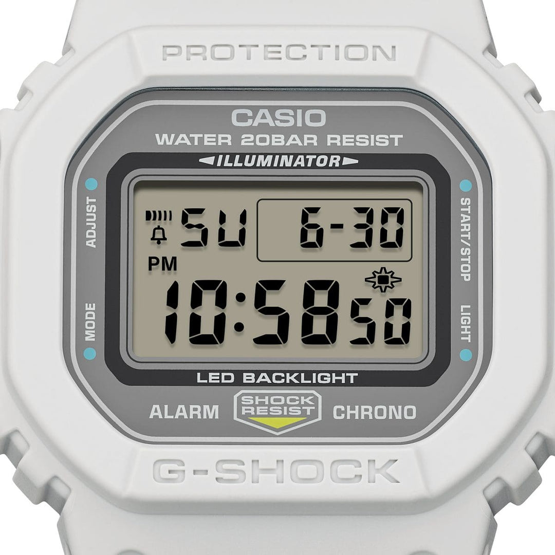 Casio G-Shock DW-5600MNC-7A8ER kellotaulu ja vaalea runko