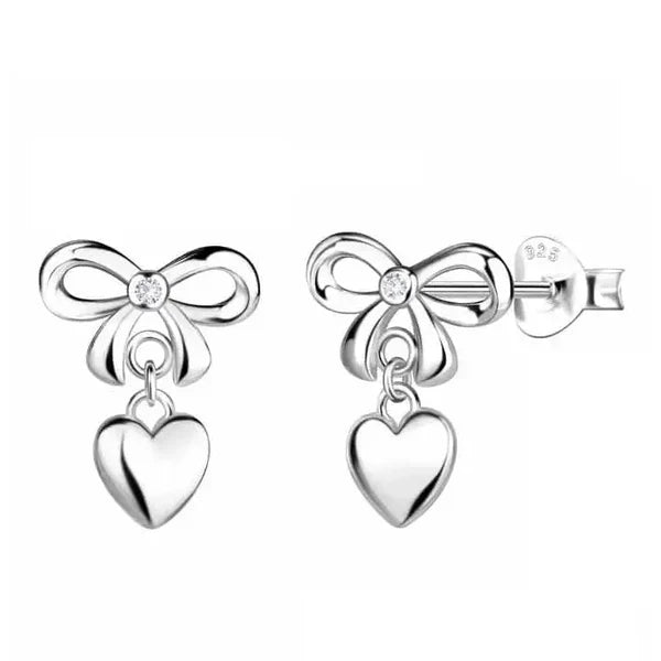 Hopeiset rusetti-korvakorut roikkuvilla sydämillä Trendi Koru